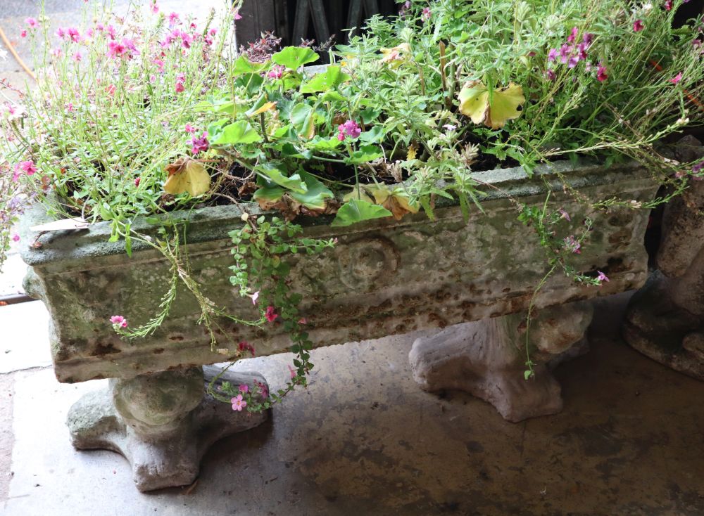 A reconstituted stone rectangular garden planter on trestle stand, length 92cm height 58cm